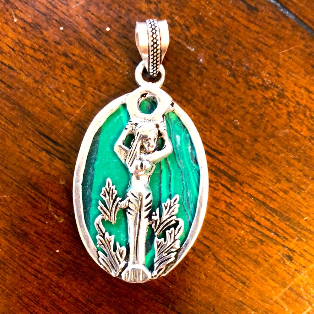 New, never worn. Silver plated fashion pendant with mermaid and stone